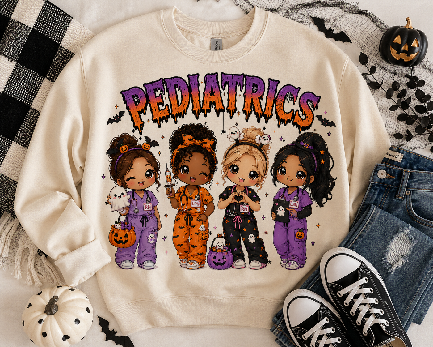 Pediatrics Halloween nurse sweatshirt in cream, with four chibi nurses holding pumpkin buckets and a ghost