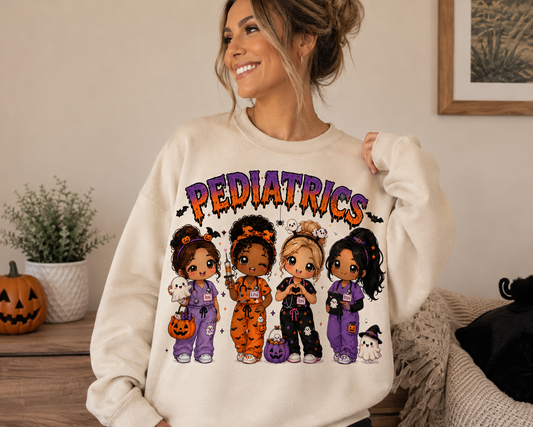 Woman wearing the cream Pediatrics Halloween nurse sweatshirt with drippy purple and orange lettering