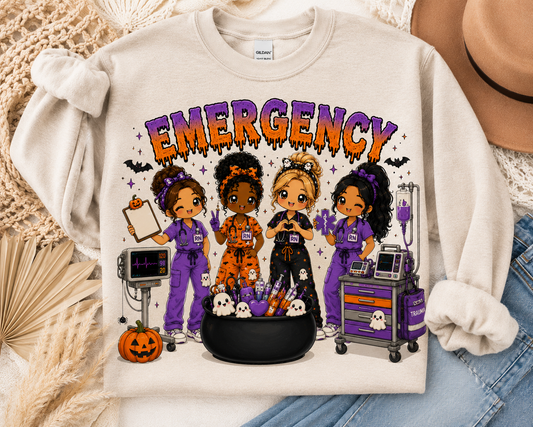 Emergency Halloween nurse sweatshirt in cream, with four chibi ER nurses, a cardiac monitor and a cauldron of syringes
