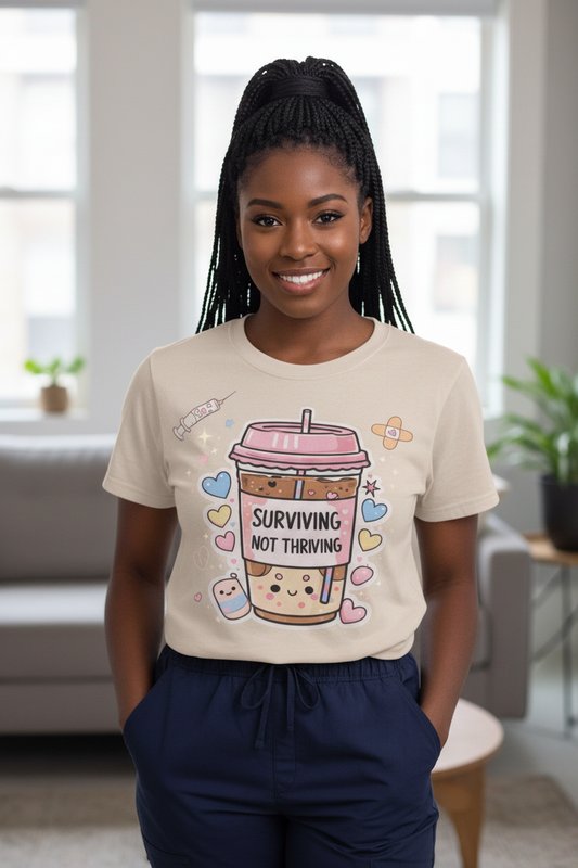 Surviving Not Thriving T-Shirt full body standing model with box braids in scrubs