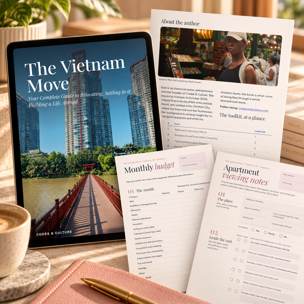 The Vietnam Move ebook cover on a tablet with About the Author page and printed toolkit worksheets